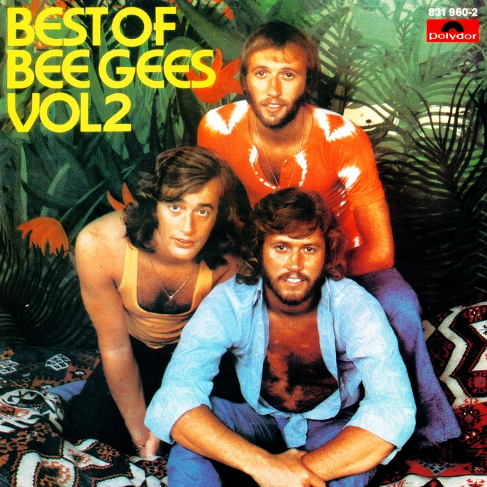best of Bee Gees volume 2, the brothers gibb sitting on a black, white , and red abstract blanket in a tropical setting