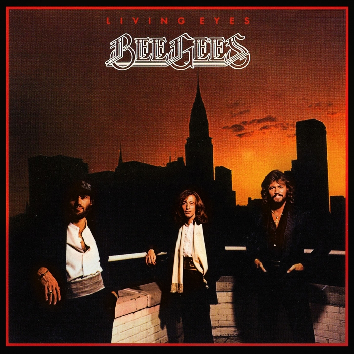 living eyes, Bee Gees, the gibb brothers wearing formal clothes on a roof top with the new york skyline during sunset in the background